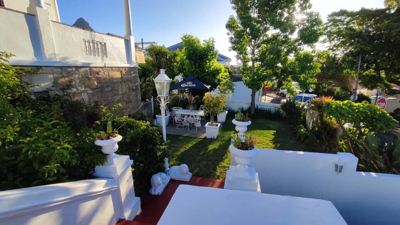Sunlit garden and patio at Stonehurst Guest House